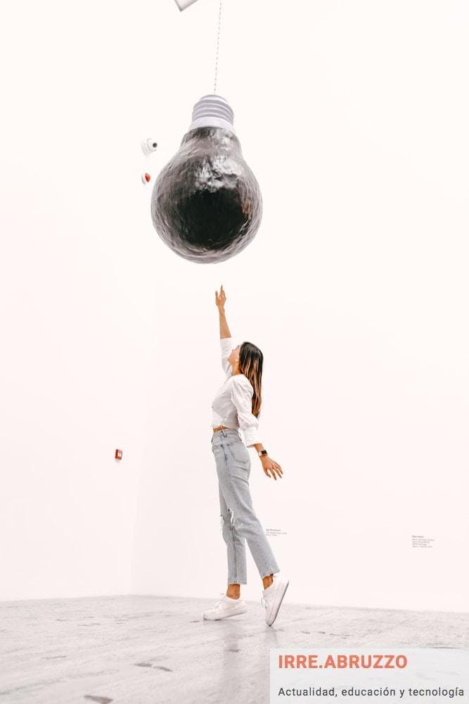woman in white sleeveless dress standing on globe